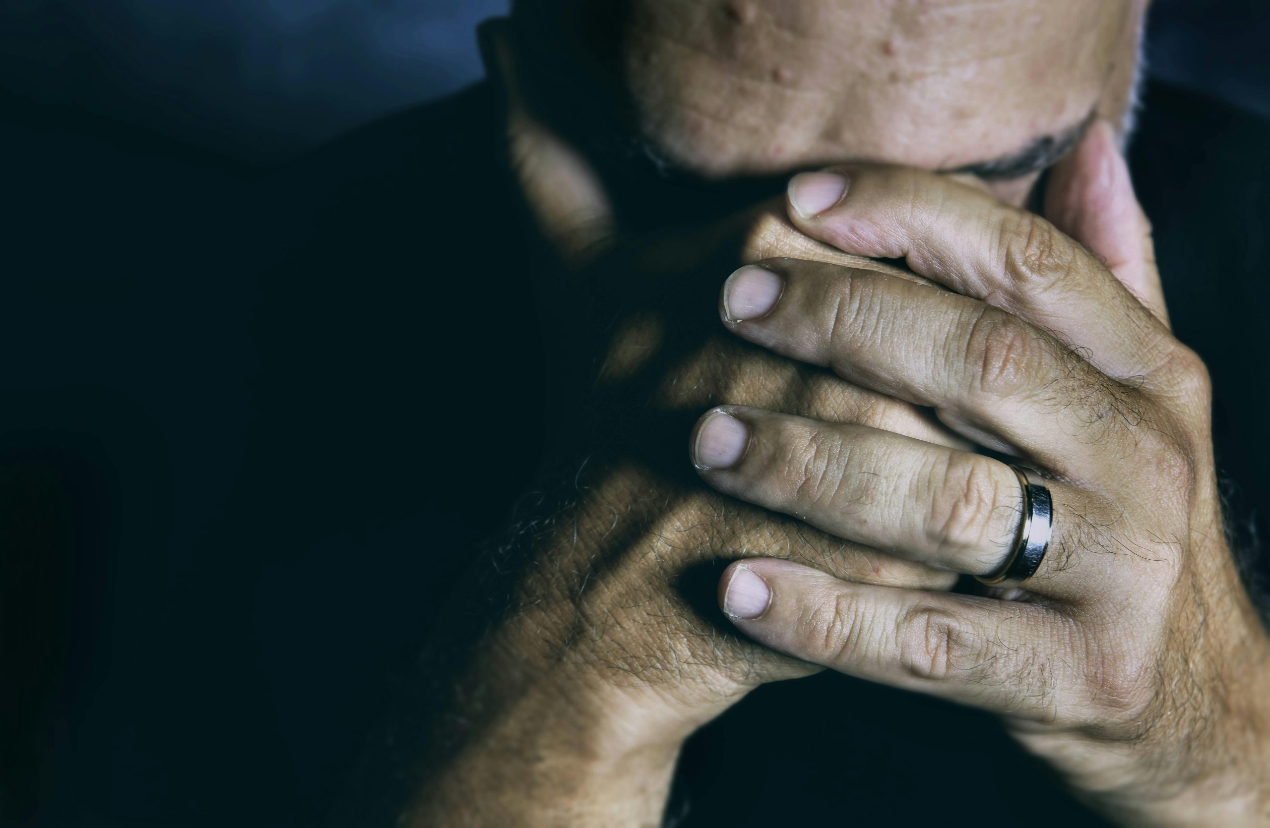 Man is depressed and considers getting depression treatment in NYC